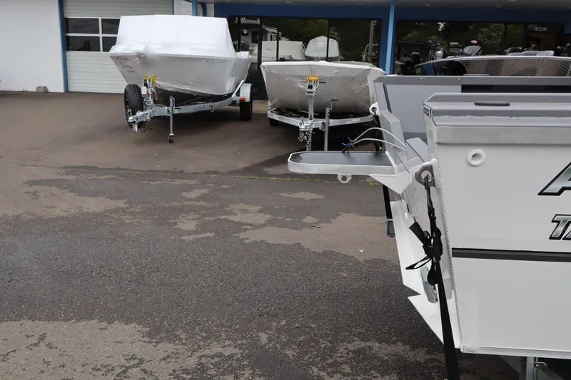 Slide: The Image of 2026 Alumaweld Talon 18 boats on trailers outside dealership. - 4
