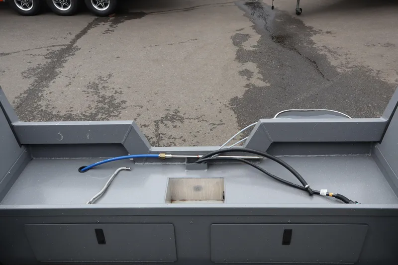 Slide: The Image of Alumaweld Talon 18 (2026) boat interior with hoses and storage compartments. - 6