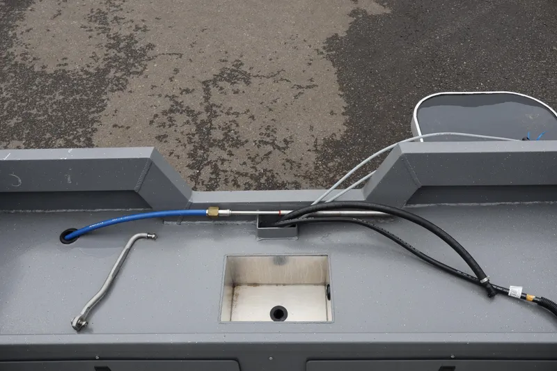 Slide: The Image of 2026 Alumaweld Talon 18 boat deck with utility sink and hoses. - 7