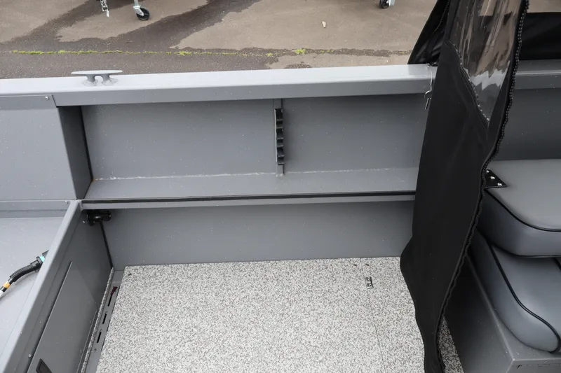 Slide: The Image of Interior view of 2026 Alumaweld Talon 18 boat, featuring gray seating and flooring. - 8