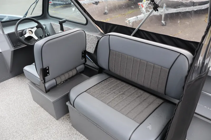 Slide: The Image of 2026 Alumaweld Talon 18 boat interior with gray seating and steering wheel. - 9