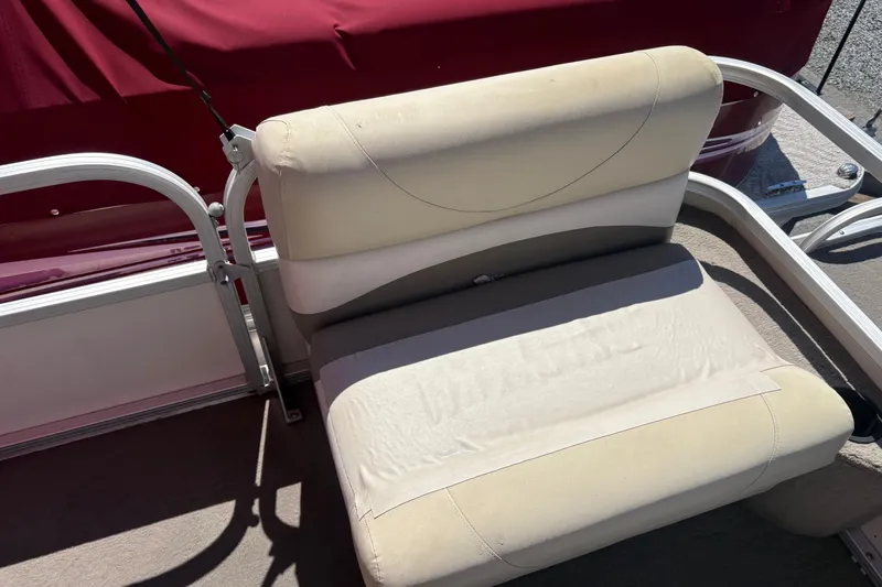 Slide: The Image of 2011 Sun Tracker Bass Buggy 18 Classic Series boat seat with beige upholstery. - 10
