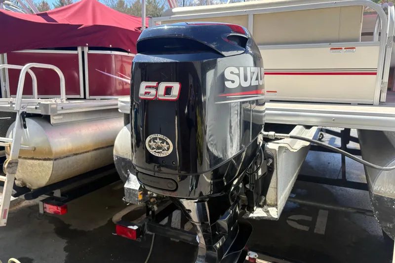 Slide: The Image of 2011 Sun Tracker Bass Buggy 18 Classic with Suzuki 60 outboard motor. - 2