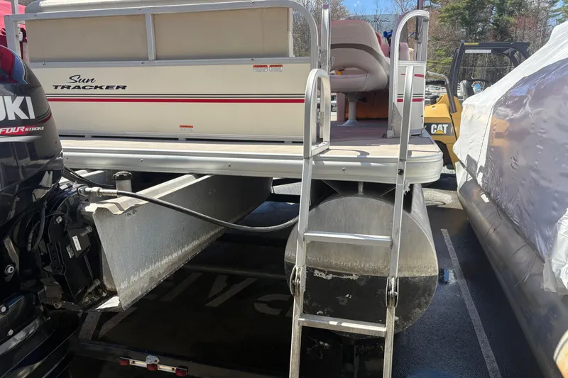 Slide: The Image of 2011 Sun Tracker Bass Buggy 18 Classic pontoon boat with Suzuki outboard motor. - 5