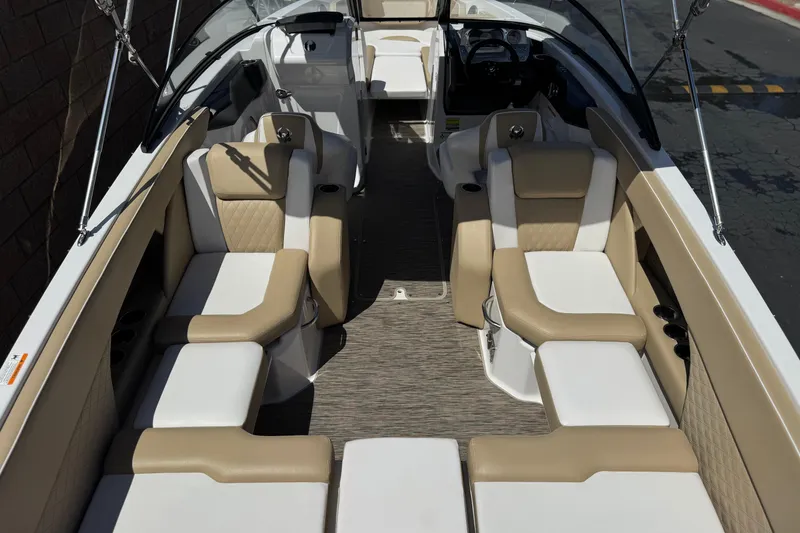 Slide: The Image of 2017 Scarab 255 H.O. Platinum boat interior with beige and white seating. - 10