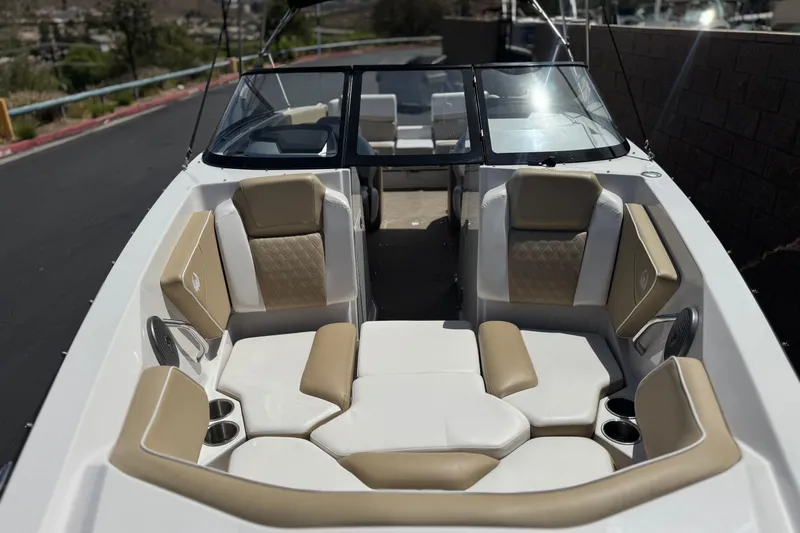 Slide: The Image of 2017 Scarab 255 H.O. Platinum boat interior with beige and white seating. - 13