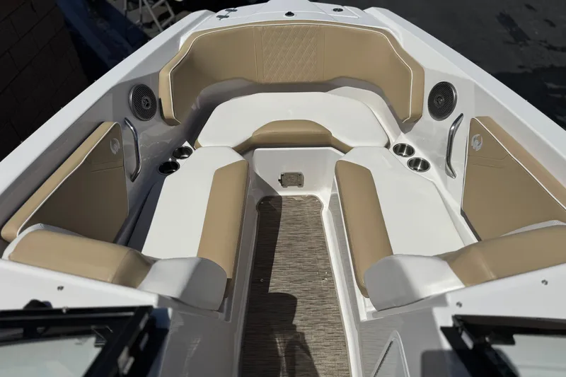 Slide: The Image of 2017 Scarab 255 H.O. Platinum boat interior with beige seating and cup holders. - 16