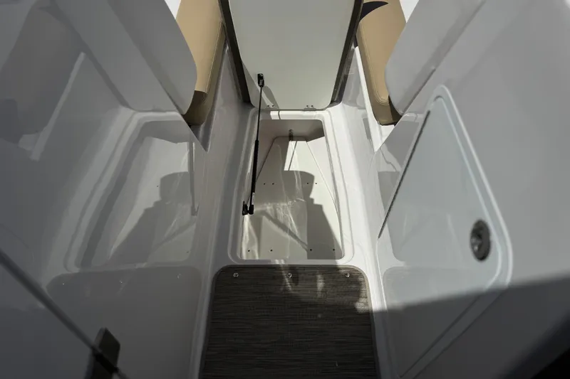 Slide: The Image of Interior view of 2017 Scarab 255 H.O. Platinum boat showing seating and storage area. - 18