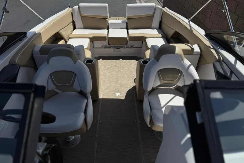 Slide: The Image of Interior of 2017 Scarab 255 H.O. Platinum boat with beige and white seating. - 19