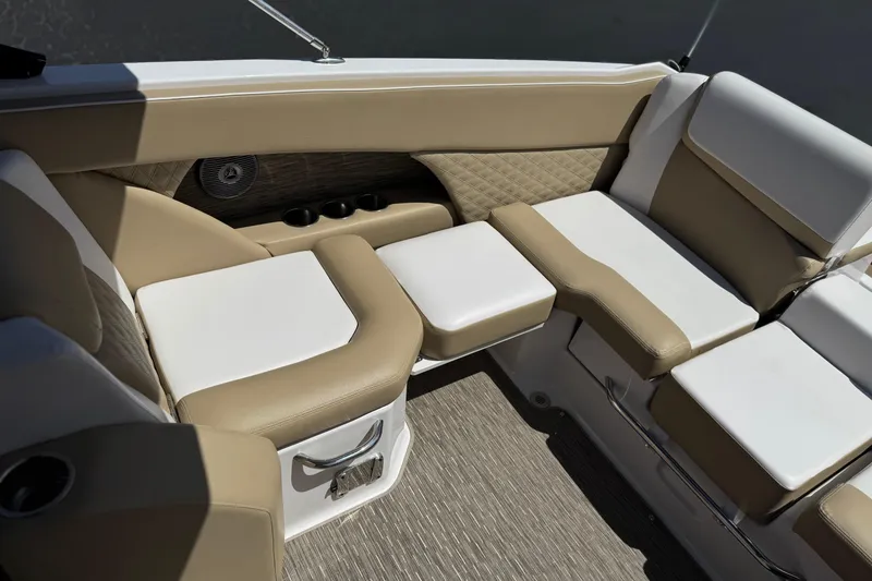 Slide: The Image of Luxurious seating area on a 2017 Scarab 255 H.O. Platinum boat, featuring beige and white upholstery. - 23