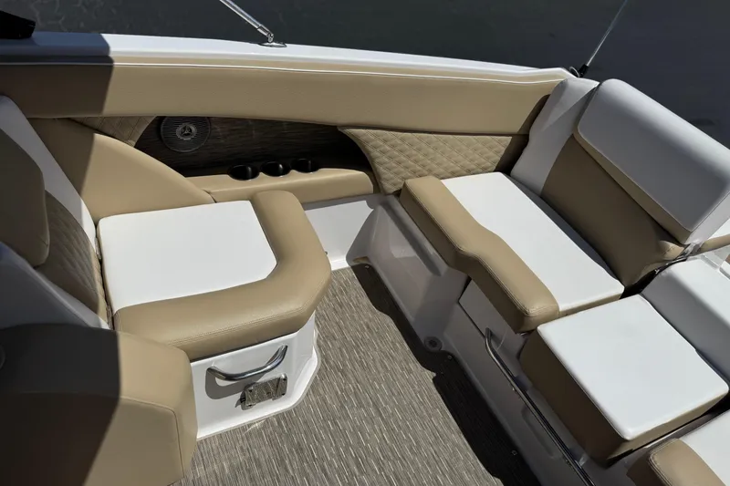 Slide: The Image of Luxurious seating in 2017 Scarab 255 H.O. Platinum boat with beige and white upholstery. - 24