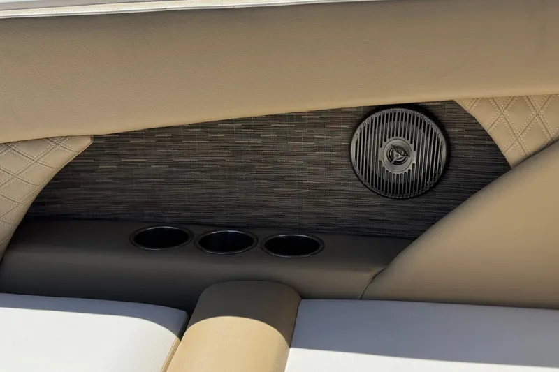 Slide: The Image of Interior of 2017 Scarab 255 H.O. Platinum boat with speaker and cup holders. - 25