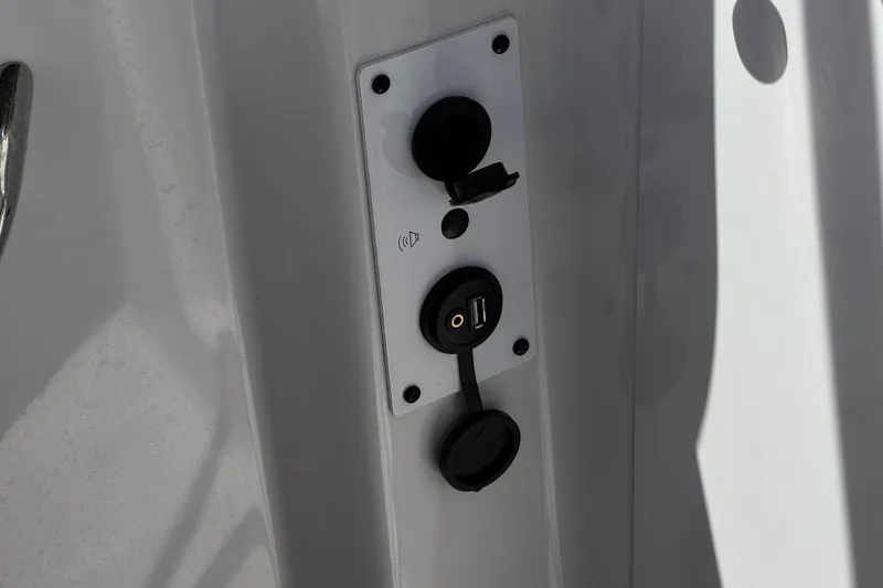 Slide: The Image of USB and audio ports on 2017 Scarab 255 H.O. Platinum boat panel. - 30