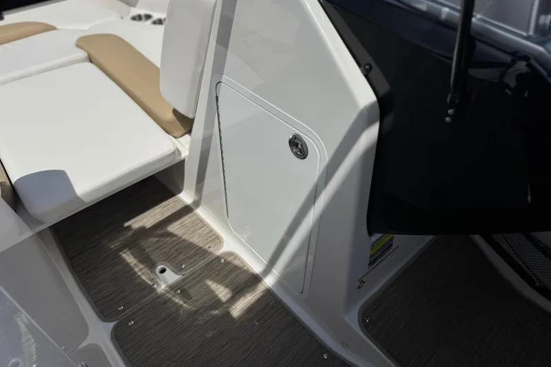 Slide: The Image of Interior view of 2017 Scarab 255 H.O. Platinum boat, featuring seating and storage compartment. - 34