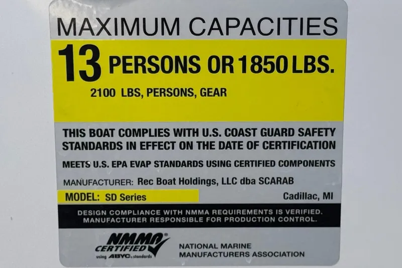 Slide: The Image of 2017 Scarab 255 H.O. Platinum boat capacity label, 13 persons or 1850 lbs, safety standards. - 37