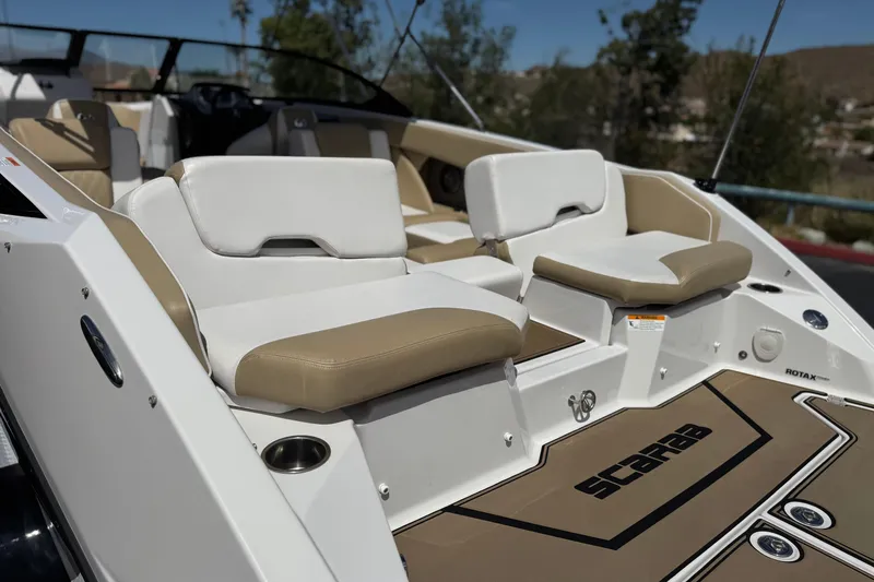 Slide: The Image of 2017 Scarab 255 H.O. Platinum boat interior with beige and white seating. - 8