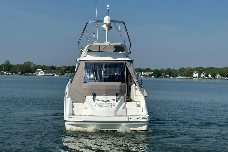 Slide: The Image of 2011 Beneteau Monte Carlo 47 Fly yacht on calm water, rear view. - 9