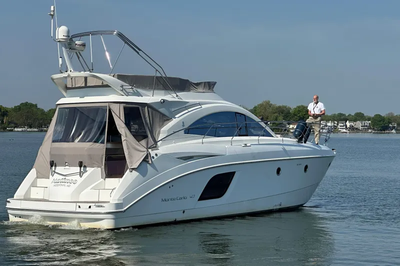 Slide: The Image of 2011 Beneteau Monte Carlo 47 Fly yacht cruising on a calm lake. - 7