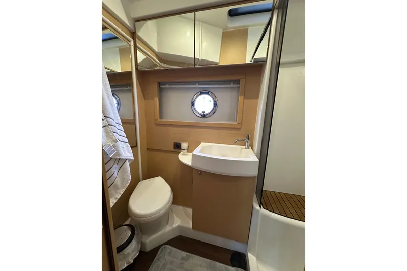 Slide: The Image of Bathroom interior of 2011 Beneteau Monte Carlo 47 Fly yacht, featuring sink, toilet, and shower. - 44