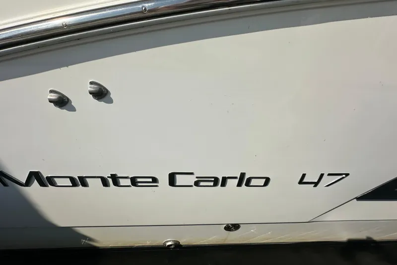 Slide: The Image of 2011 Beneteau Monte Carlo 47 Fly yacht nameplate on hull. - 46