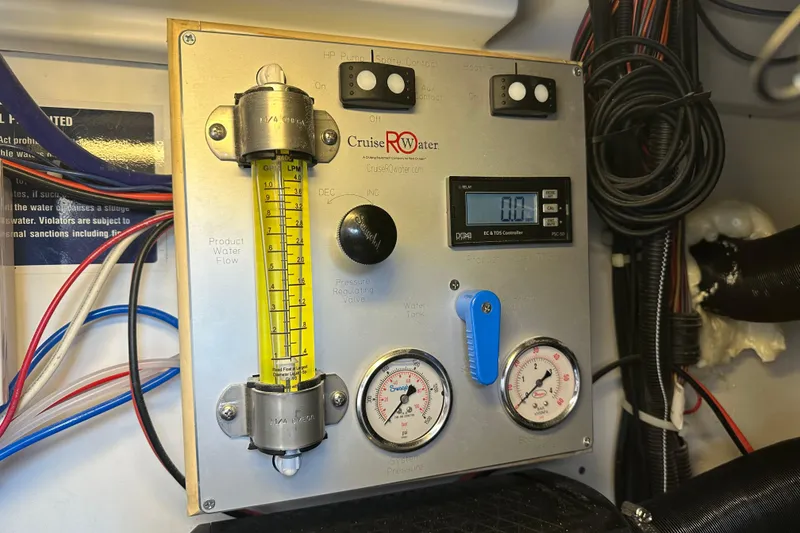 Slide: The Image of Control panel of a 2011 Beneteau Monte Carlo 47 Fly water system. - 50