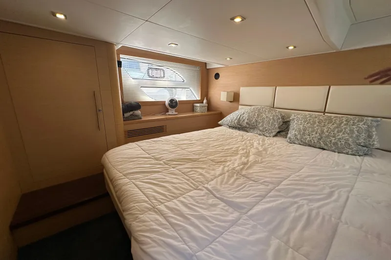 Slide: The Image of Luxurious bedroom interior of 2011 Beneteau Monte Carlo 47 Fly yacht. - 41