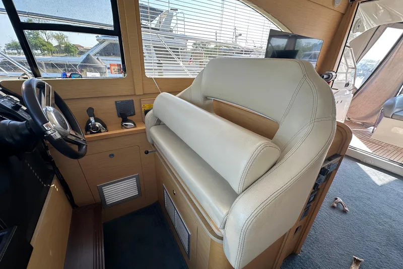 Slide: The Image of Interior helm of 2011 Beneteau Monte Carlo 47 Fly yacht with leather seating. - 24