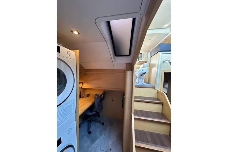Slide: The Image of Interior of 2011 Beneteau Monte Carlo 47 Fly with stairs, desk, and washer-dryer. - 30