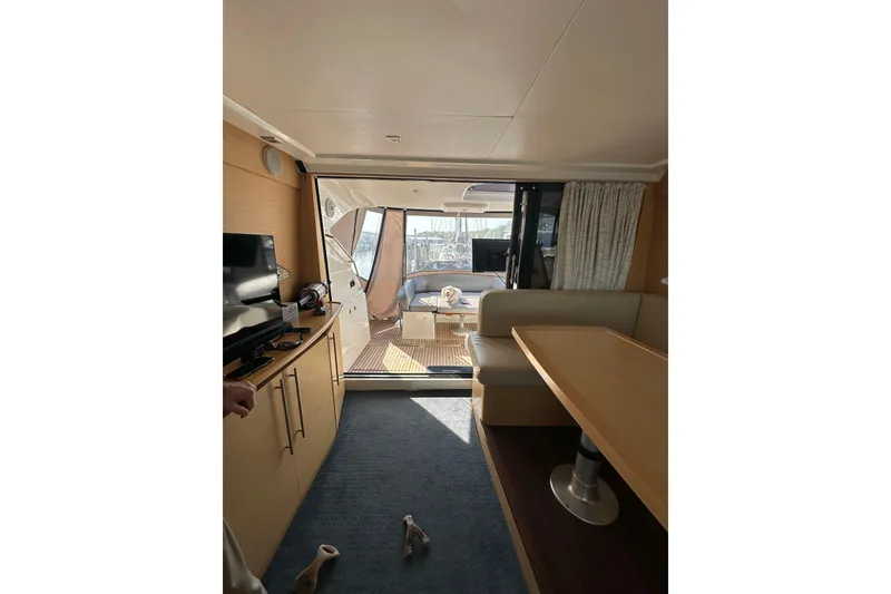 Slide: The Image of Interior of 2011 Beneteau Monte Carlo 47 Fly yacht, featuring modern furnishings and spacious layout. - 18