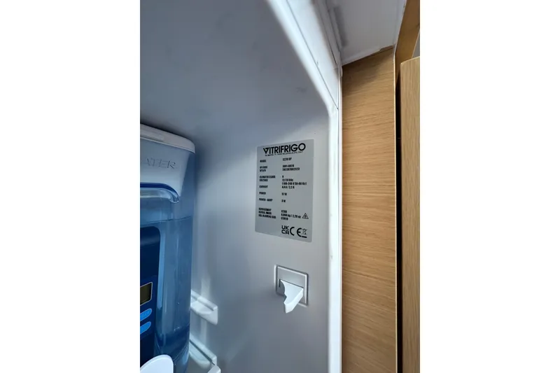 Slide: The Image of Interior view of a Vitrifrigo refrigerator in a 2011 Beneteau Monte Carlo 47 Fly yacht. - 34