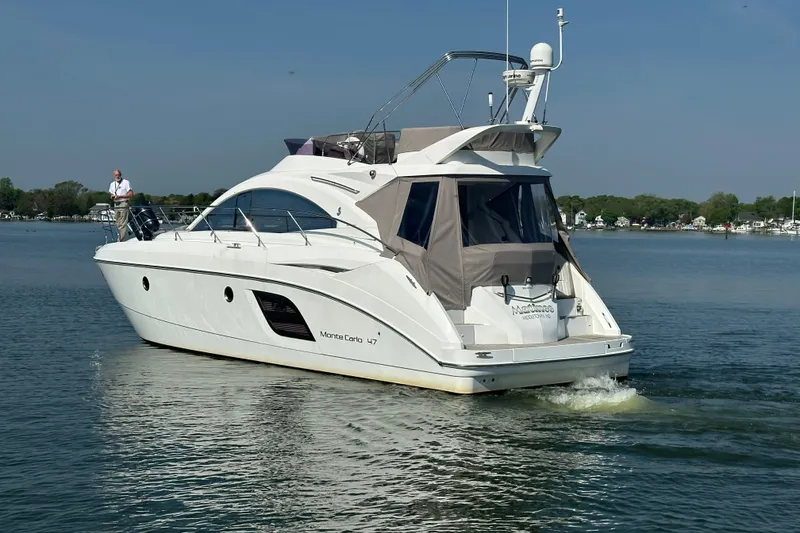 Slide: The Image of 2011 Beneteau Monte Carlo 47 Fly yacht cruising on a calm lake. - 3
