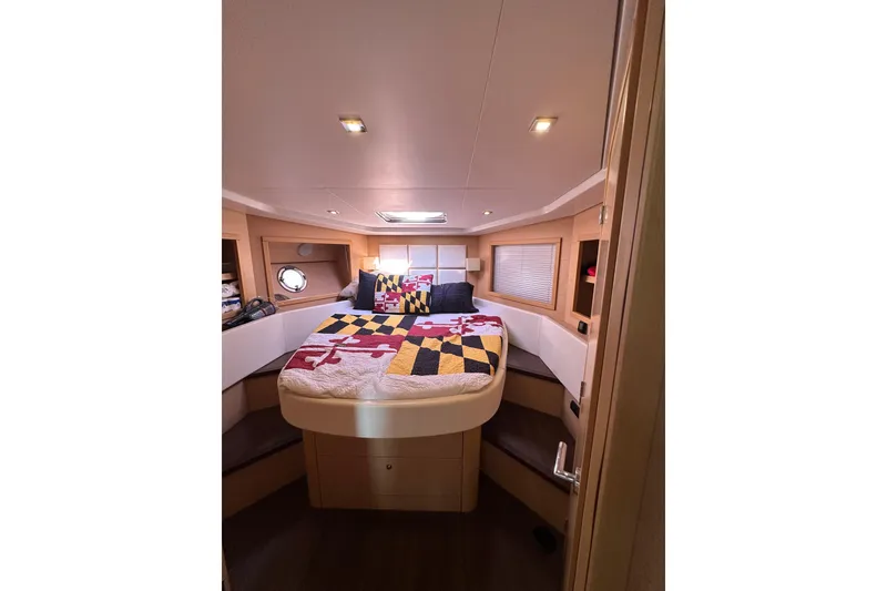 Slide: The Image of Luxurious cabin interior of 2011 Beneteau Monte Carlo 47 Fly yacht with cozy bedding. - 35