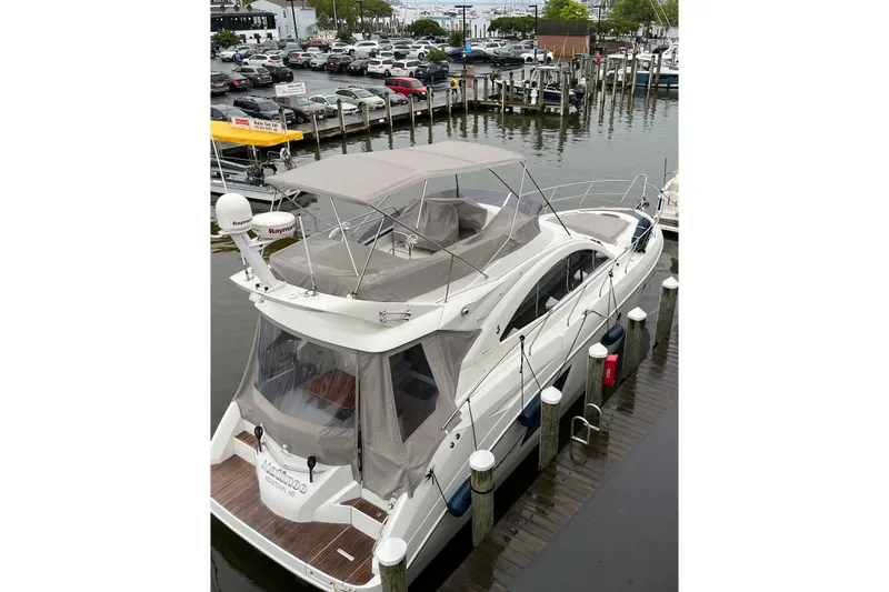 Slide: The Image of 2011 Beneteau Monte Carlo 47 Fly yacht docked at marina, aerial view. - 14