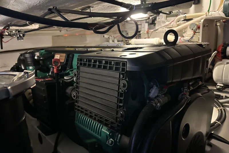 Slide: The Image of Engine room of 2011 Beneteau Monte Carlo 47 Fly yacht, showcasing mechanical components. - 53