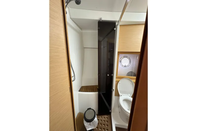 Slide: The Image of Bathroom interior of 2011 Beneteau Monte Carlo 47 Fly yacht, featuring shower and toilet. - 40