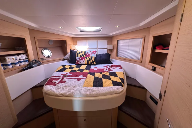 Slide: The Image of Luxurious cabin interior of 2011 Beneteau Monte Carlo 47 Fly yacht with cozy bedding. - 36