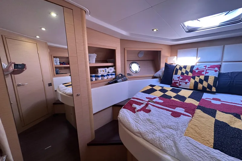 Slide: The Image of Luxurious cabin interior of 2011 Beneteau Monte Carlo 47 Fly yacht with colorful bedding. - 37