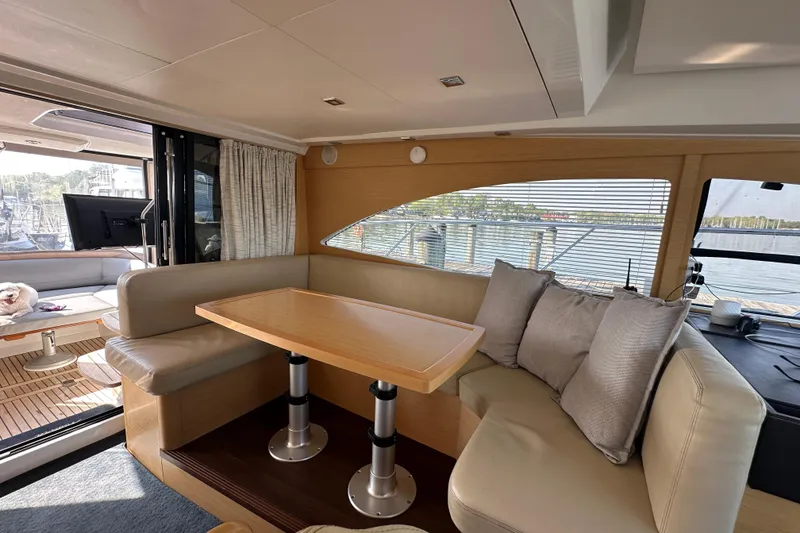 Slide: The Image of Interior of 2011 Beneteau Monte Carlo 47 Fly yacht with elegant seating and dining area. - 17