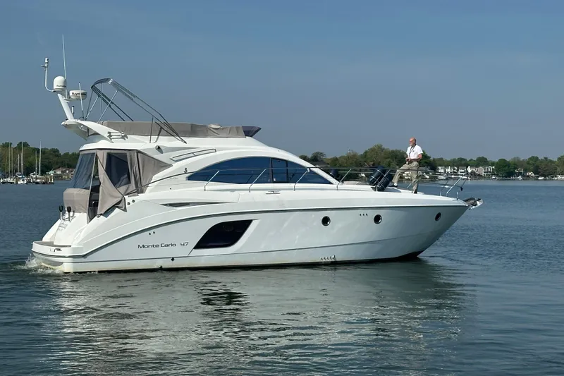 The Image of 2011 Beneteau Monte Carlo 47 Fly yacht cruising on calm waters. - 0