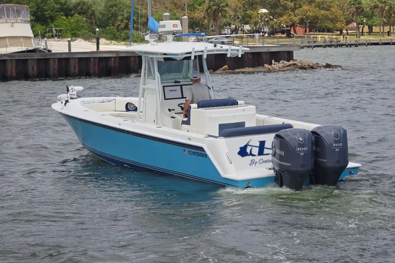 Slide: The Image of 2012 Contender 32 LS boat with dual Yamaha engines on the water. - 6