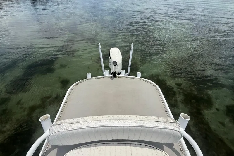 Slide: The Image of 2016 Dorado 25 SE boat on calm water, viewed from the deck. - 14