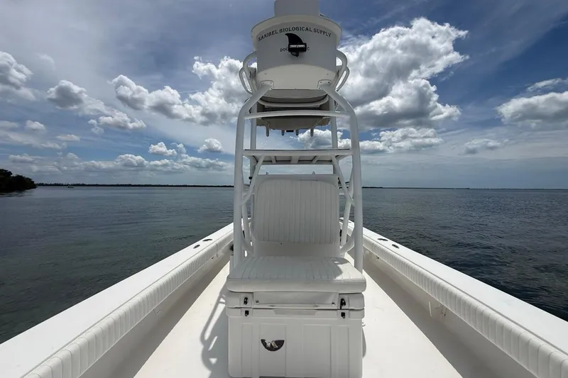 Slide: The Image of 2016 Dorado 25 SE boat on calm water under a partly cloudy sky. - 16