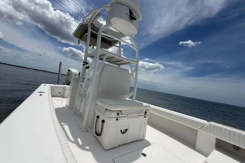 Slide: The Image of 2016 Dorado 25 SE boat on calm ocean under blue sky. - 18