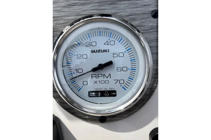 Slide: The Image of Close-up of Suzuki RPM gauge on 2025 Carolina Skiff 21LS boat dashboard. - 15