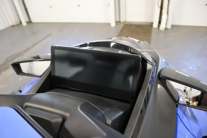 Slide: The Image of 2025 Sea-Doo Wake Pro 230 dashboard with sleek digital display and mirrors. - 14