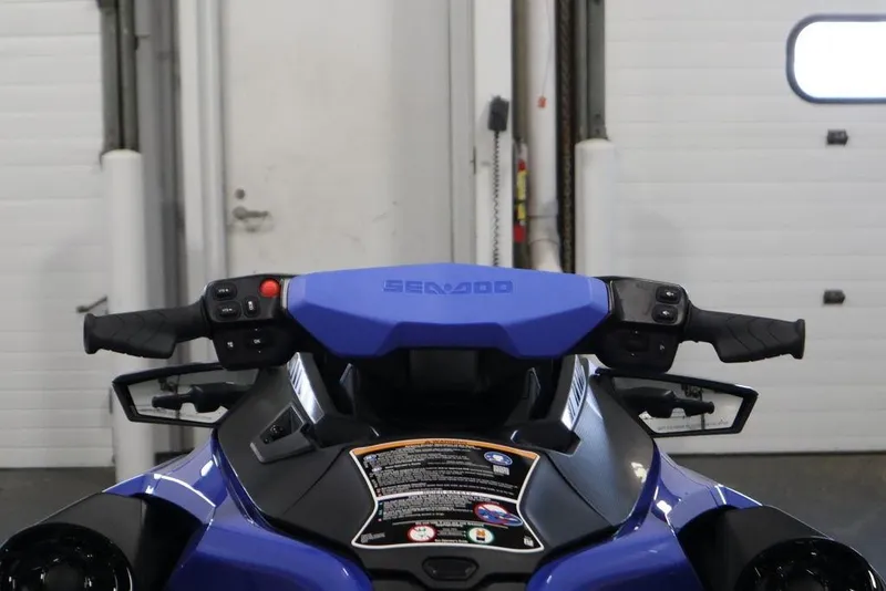 Slide: The Image of 2025 Sea-Doo Wake Pro 230 handlebars and dashboard in a garage setting. - 16
