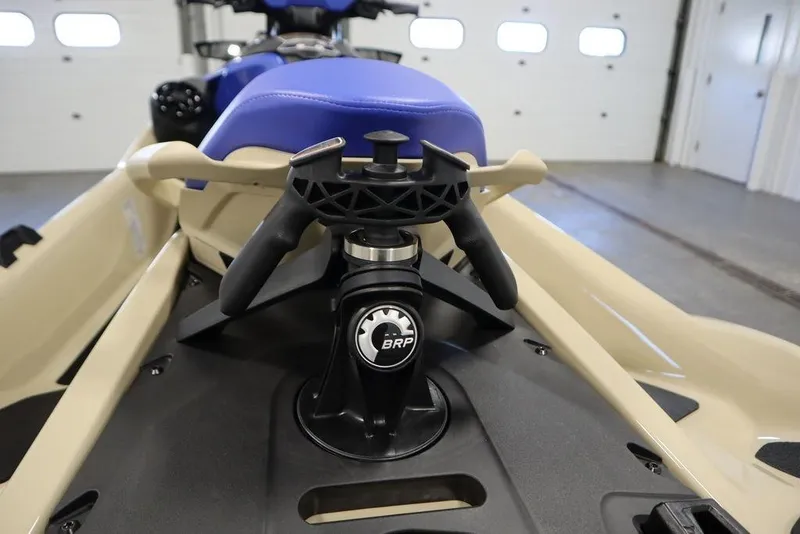 Slide: The Image of 2025 Sea-Doo Wake Pro 230 jet ski with ergonomic handlebar design in a garage setting. - 24