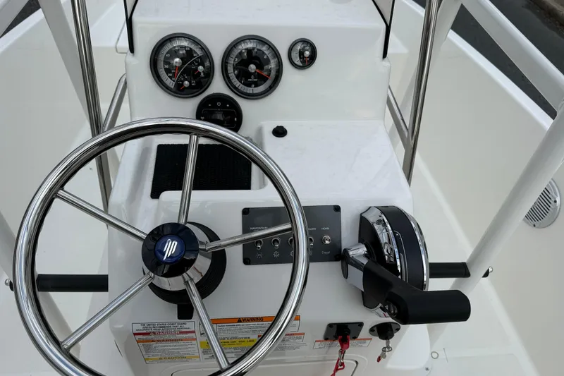 Slide: The Image of Steering console of 2026 Bayliner Trophy T18 boat with gauges and controls. - 11
