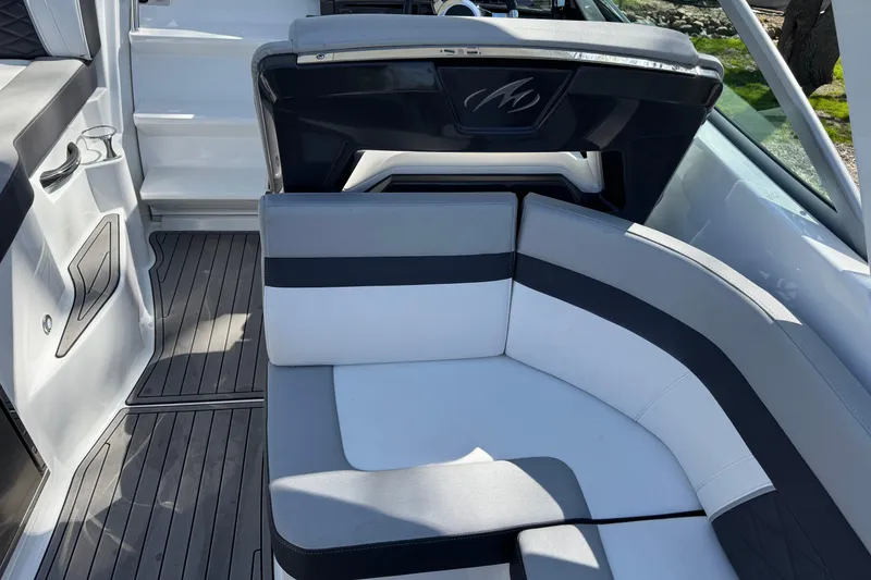 Slide: The Image of 2021 Monterey 295 Sport Yacht interior with sleek seating and modern design. - 12