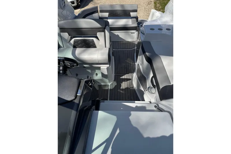 Slide: The Image of 2021 Monterey 295 Sport Yacht interior with sleek seating and modern design. - 14